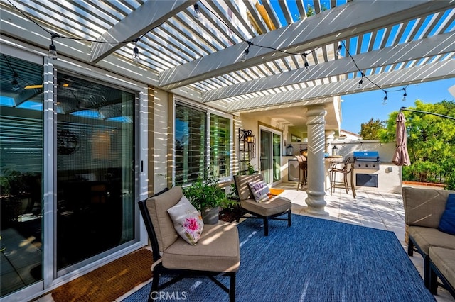 view of patio featuring an outdoor kitchen, a pergola, area for grilling, and outdoor lounge area
