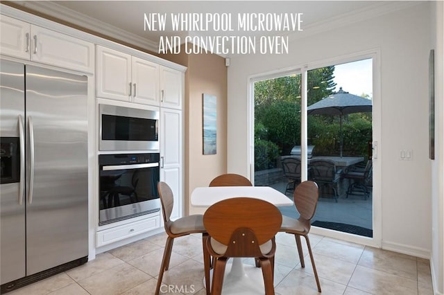 473 Periwinkle St, Fullerton, CA 92835 - dining room featuring crown molding, light tile patterned floors, and baseboards