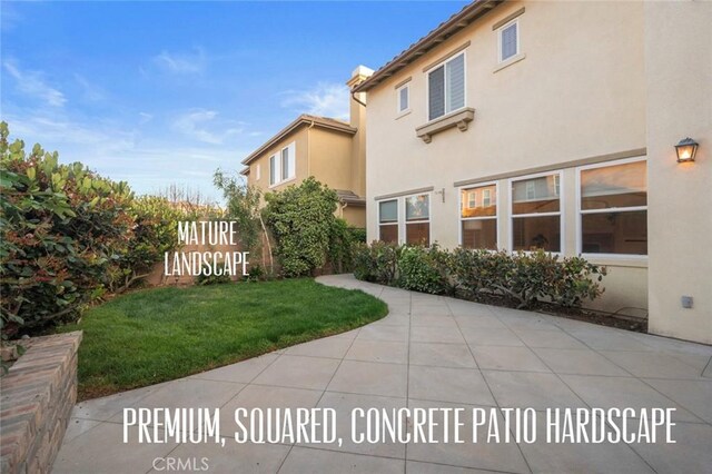 473 Periwinkle St, Fullerton, CA 92835 - view of grassy yard featuring a patio