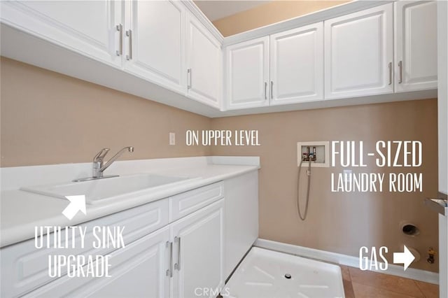 473 Periwinkle St, Fullerton, CA 92835 - washroom featuring hookup for a washing machine, cabinet space, tile patterned floors, and baseboards