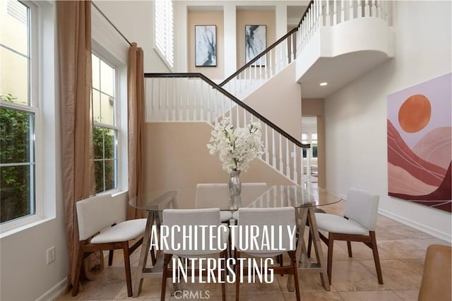 473 Periwinkle St, Fullerton, CA 92835 - dining room featuring stairway, a towering ceiling, tile patterned flooring, and baseboards