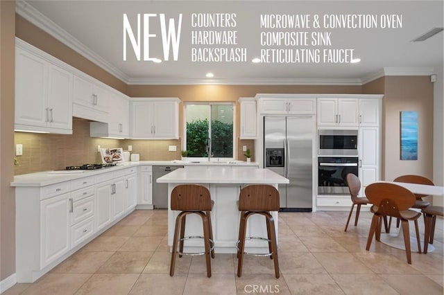 473 Periwinkle St, Fullerton, CA 92835 - kitchen featuring built in appliances, light countertops, ornamental molding, white cabinets, and tasteful backsplash