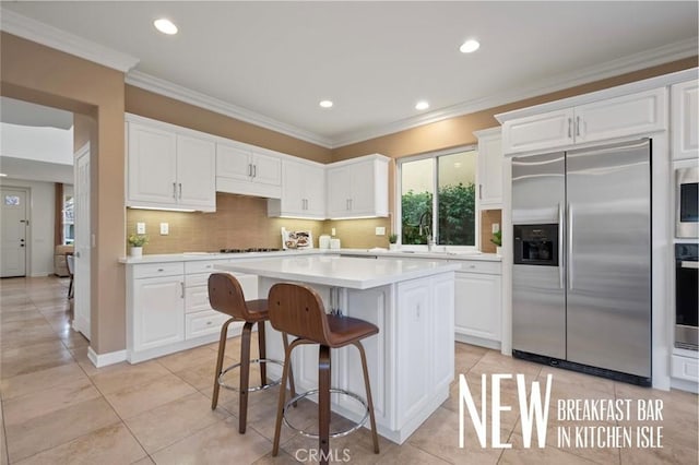 473 Periwinkle St, Fullerton, CA 92835 - kitchen featuring appliances with stainless steel finishes, a sink, light countertops, white cabinets, and recessed lighting