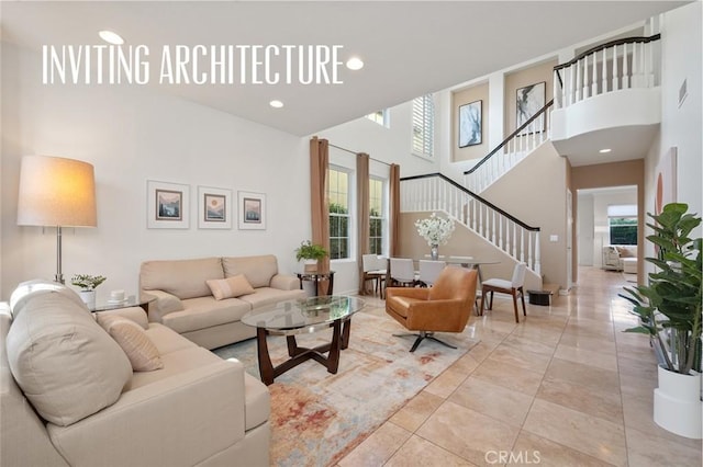 473 Periwinkle St, Fullerton, CA 92835 - living room featuring stairs, a high ceiling, and recessed lighting