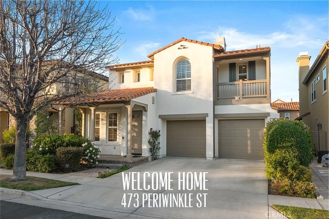 473 Periwinkle St, Fullerton, CA 92835 - mediterranean / spanish house featuring a garage, stucco siding, a tile roof, driveway, and a balcony