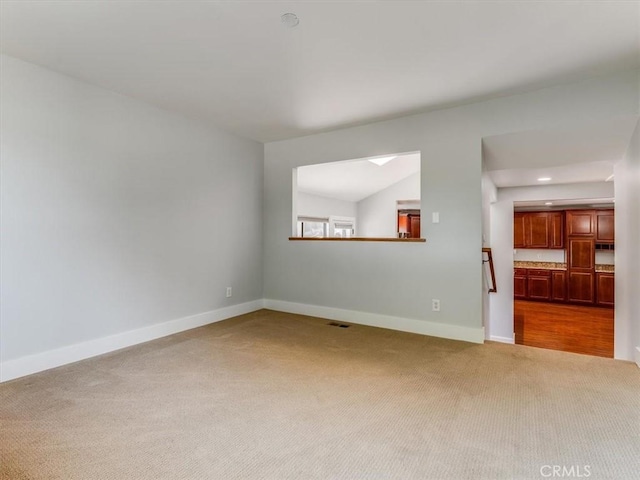 empty room featuring recessed lighting, baseboards, visible vents, and carpet