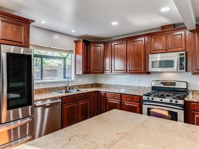 kitchen featuring a sink, stainless steel appliances, and recessed lighting