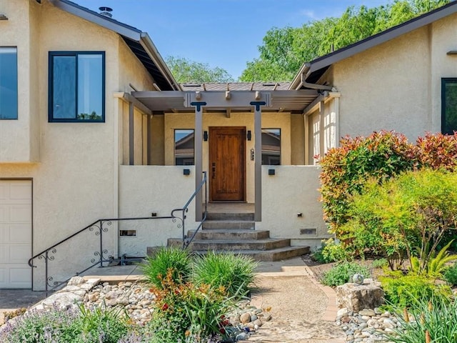 entrance to property with stucco siding