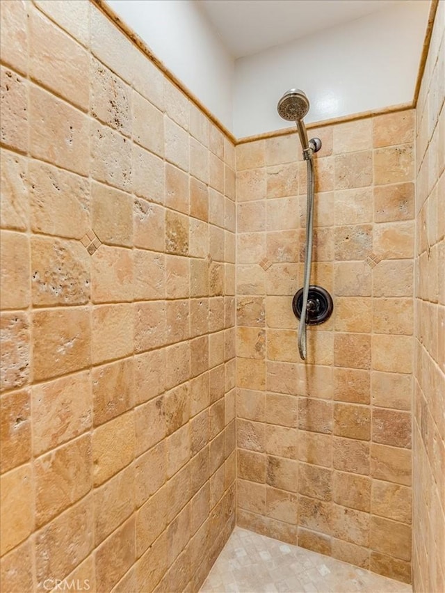 bathroom with tiled shower