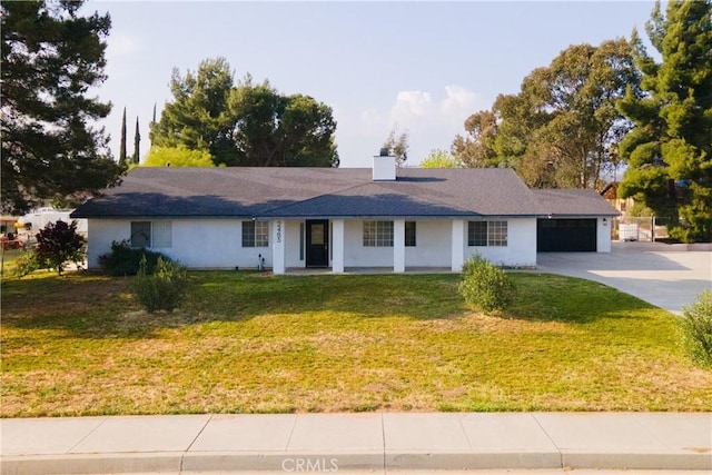 ranch-style home with a porch, a chimney, a front yard, concrete driveway, and an attached garage