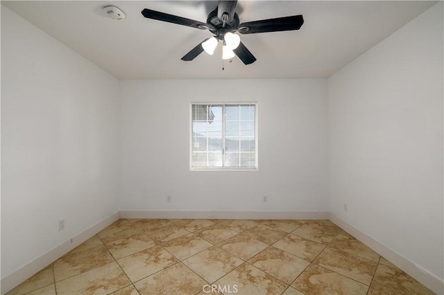 unfurnished room with light tile patterned floors, baseboards, and a ceiling fan