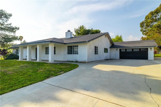 ranch-style home with an attached garage, concrete driveway, and stucco siding