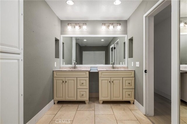 2485 W Westward Ave, Banning, CA 92220 - full bath with double vanity and baseboards