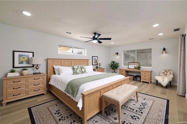 bedroom featuring ceiling fan, light wood-type flooring, visible vents, and recessed lighting