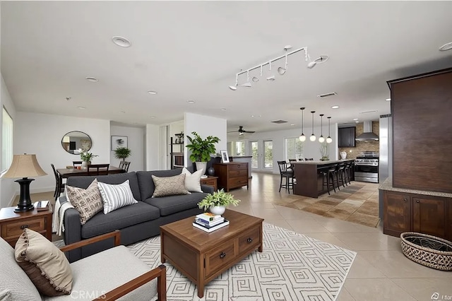 2485 W Westward Ave, Banning, CA 92220 - living room featuring light tile patterned floors, rail lighting, ceiling fan, and recessed lighting