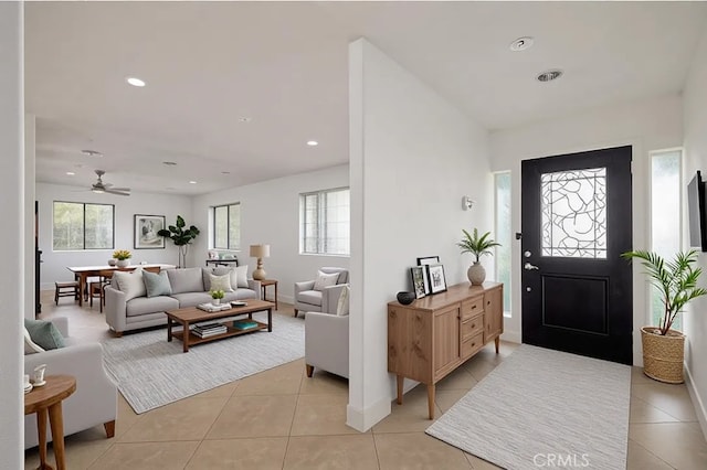 2485 W Westward Ave, Banning, CA 92220 - foyer entrance with healthy amount of natural light, light tile patterned floors, ceiling fan, recessed lighting, and baseboards