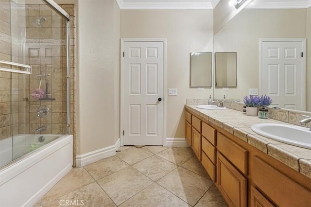 bathroom with baseboards, enclosed tub / shower combo, ornamental molding, and a sink