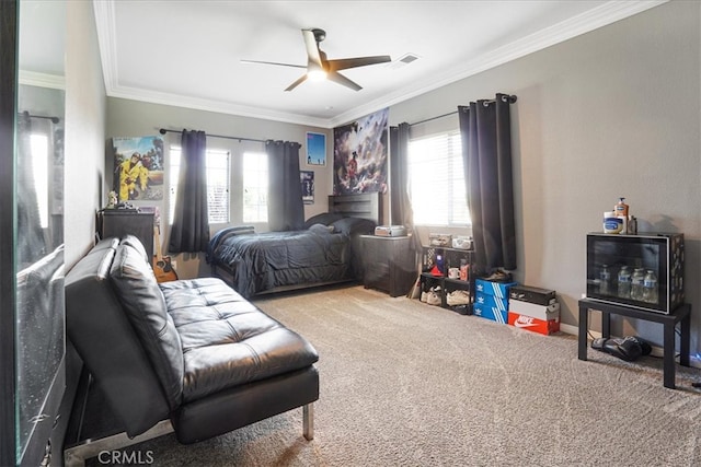 bedroom with crown molding, multiple windows, and carpet