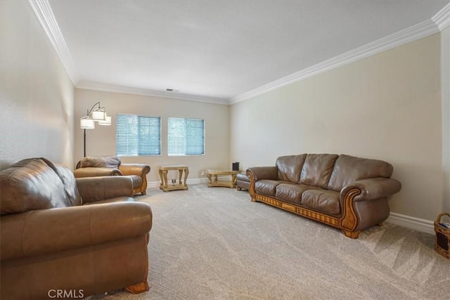 living area with baseboards, ornamental molding, and carpet flooring