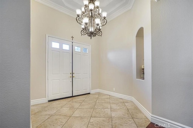 entryway featuring crown molding, arched walkways, a notable chandelier, and light tile patterned flooring