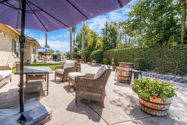 view of patio / terrace featuring outdoor dining area and an outdoor living space