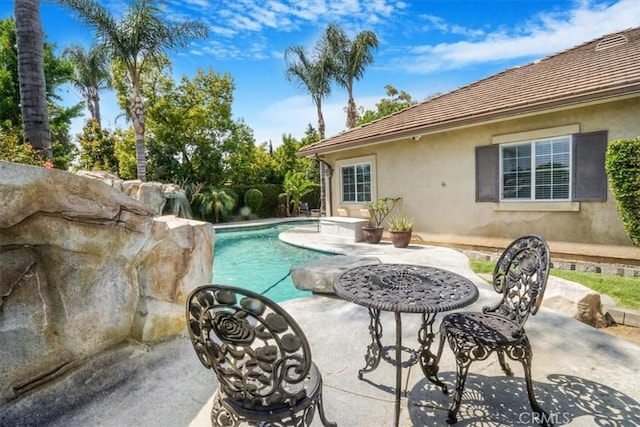 outdoor pool with a patio