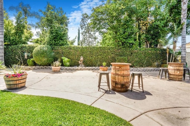 view of patio / terrace featuring outdoor dining area and a fenced backyard