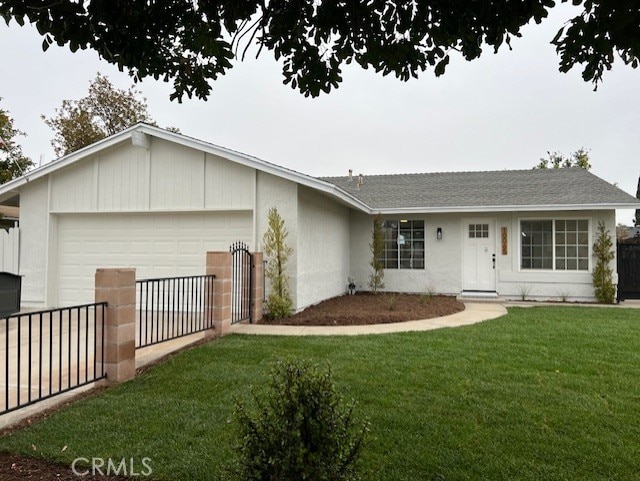 10065 Tudor Ave, Montclair, CA 91763 - single story home featuring a front lawn, fence, stucco siding, an attached garage, and driveway