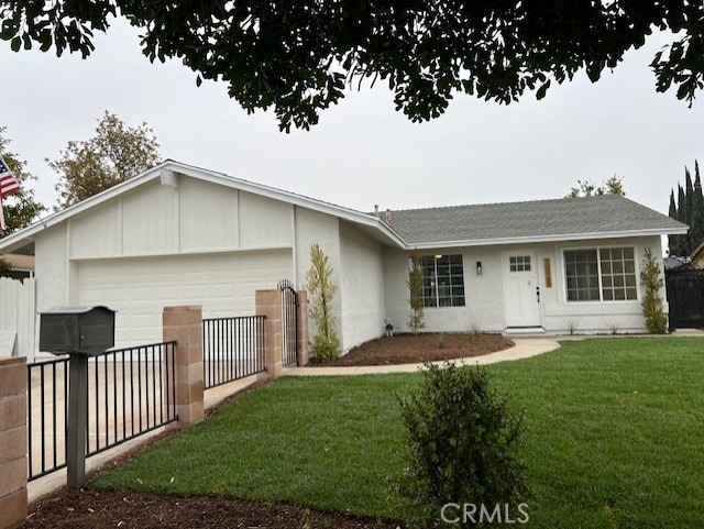 10065 Tudor Ave, Montclair, CA 91763 - ranch-style home featuring fence, a front lawn, concrete driveway, an attached garage, and stucco siding