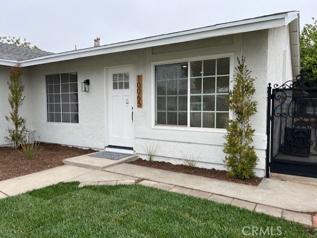 10065 Tudor Ave, Montclair, CA 91763 - entrance to property with stucco siding