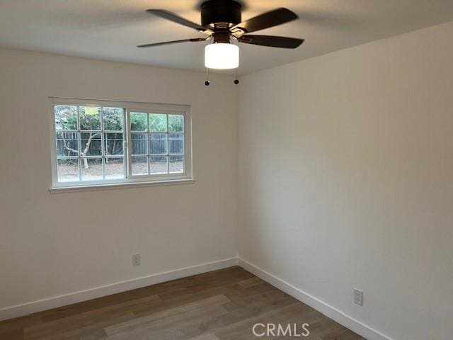 10065 Tudor Ave, Montclair, CA 91763 - empty room featuring baseboards, ceiling fan, and wood finished floors