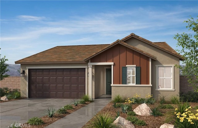 ranch-style house with a garage, board and batten siding, stucco siding, and concrete driveway