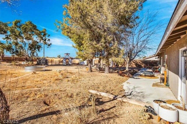 4796 Camarilla Ave, Yucca Valley, CA 92284 - view of yard featuring a patio area and fence