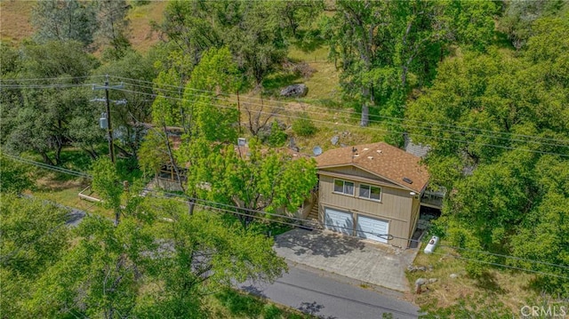 drone / aerial view with a view of trees