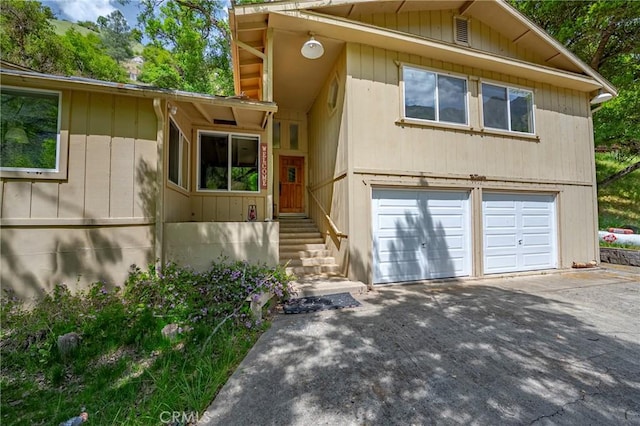 view of front facade featuring concrete driveway and an attached garage