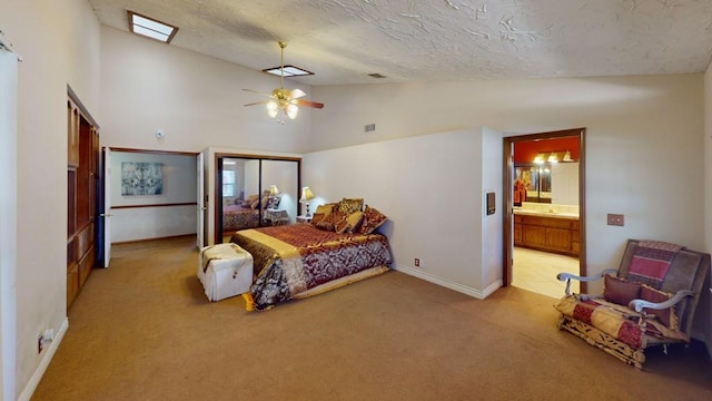 bedroom with a textured ceiling, visible vents, baseboards, lofted ceiling, and light carpet