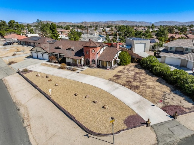 drone / aerial view featuring a mountain view and a residential view