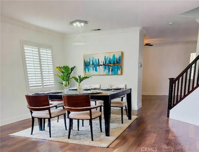 12851 Oakdale St, Eastvale, CA 92880 - dining space with wood finished floors, stairs, ornamental molding, baseboards, and a chandelier