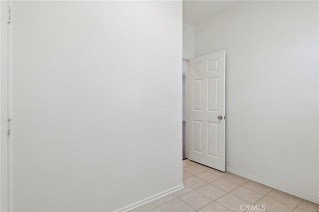 12851 Oakdale St, Eastvale, CA 92880 - empty room with light tile patterned flooring and baseboards