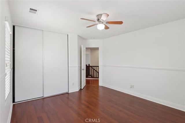 12851 Oakdale St, Eastvale, CA 92880 - unfurnished bedroom with a closet, baseboards, wood finished floors, and a ceiling fan