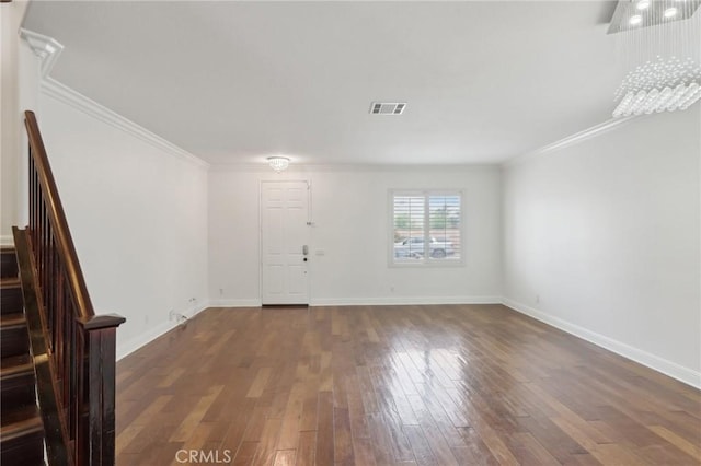 12851 Oakdale St, Eastvale, CA 92880 - foyer entrance with stairs, dark wood-type flooring, ornamental molding, and baseboards