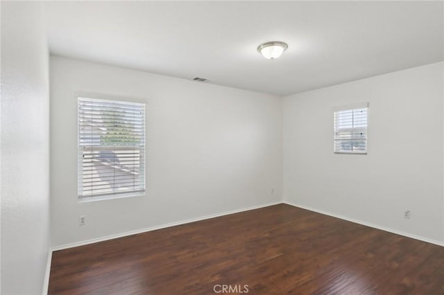 12851 Oakdale St, Eastvale, CA 92880 - empty room with wood finished floors and baseboards