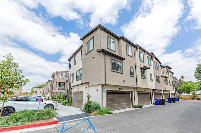 11751 Florence Ave, Santa Fe Springs, CA 90670 - view of building exterior featuring an attached garage and a residential view