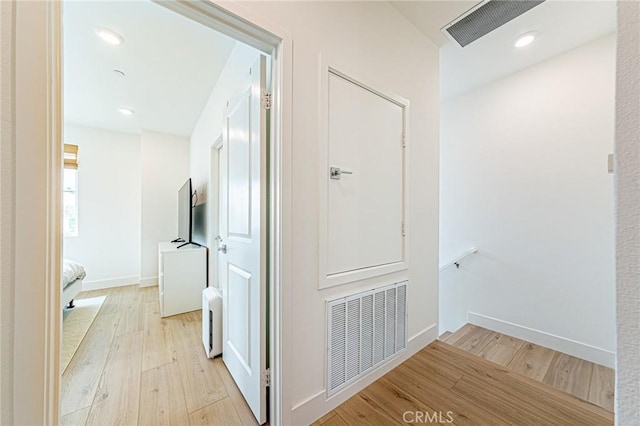 11751 Florence Ave, Santa Fe Springs, CA 90670 - corridor with light wood-style floors, baseboards, and visible vents