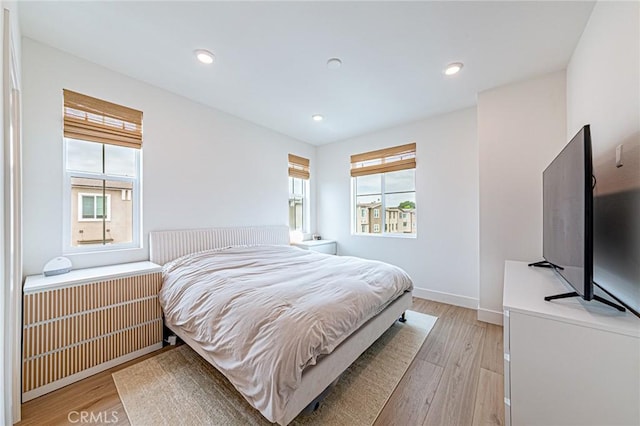 11751 Florence Ave, Santa Fe Springs, CA 90670 - bedroom featuring recessed lighting, baseboards, and light wood finished floors