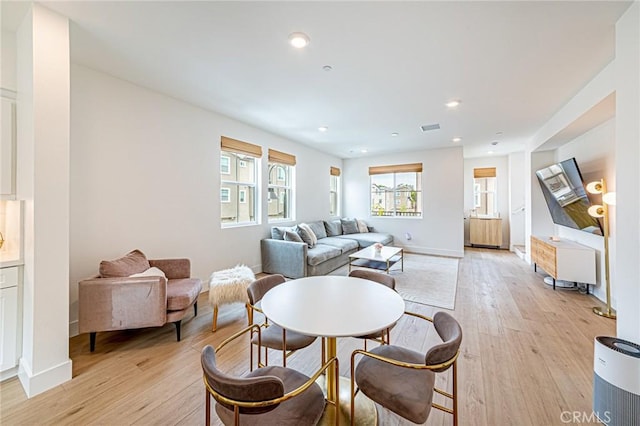 11751 Florence Ave, Santa Fe Springs, CA 90670 - living room with baseboards, visible vents, and light wood-style flooring