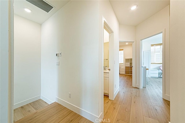 11751 Florence Ave, Santa Fe Springs, CA 90670 - hall featuring light wood-type flooring, recessed lighting, baseboards, and visible vents