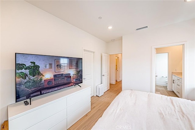 11751 Florence Ave, Santa Fe Springs, CA 90670 - bedroom with visible vents, recessed lighting, light wood finished floors, and ensuite bath