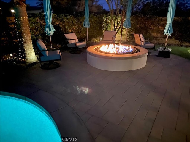 view of patio / terrace featuring a fire pit