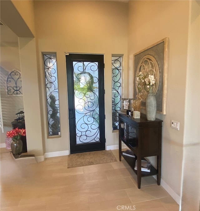 foyer entrance with baseboards